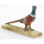 A Beswick model of a pheasant on a rectangular base, model no. 1774. Marked under. Approx. 5" x 8