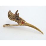 A novelty letter clip of bird head form. 21stC 5" long Please Note - we do not make reference to the