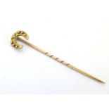 A 9ct gold stick pin with horseshoe decoration to top 1 1/2" long Please Note - we do not make