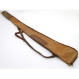 Shooting: A Brady-type canvas and leather gunslip with wool lining, having shoulder strap and