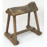 A wooden saddle horse / saddle stand. Approx. 29 1/2" high x 32 1/2" wide x 22 1/2" deep Please Note