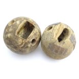 Farming bygone: a pair of hardwood spherical weights, possibly animal tethers or halter weights,