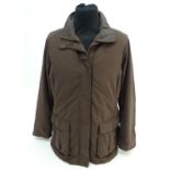 A Musto brown jacket, ladies size 18, with tags Please Note - we do not make reference to the
