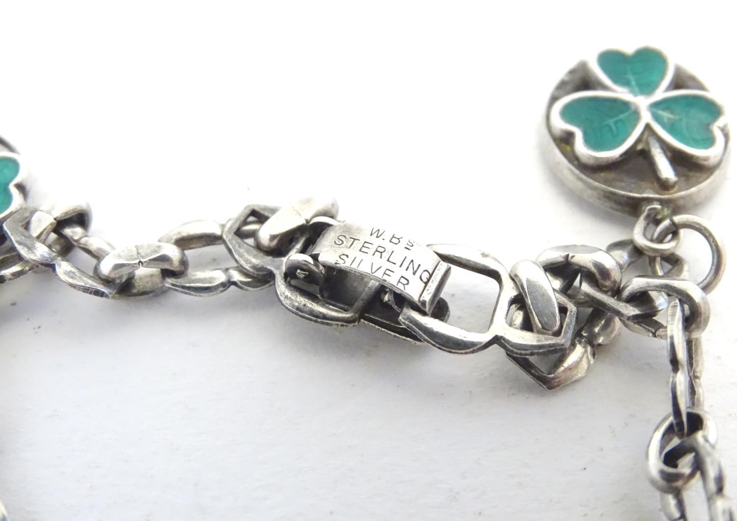 A silver charm bracelet set with various charms including horseshoe, horsehead and horseshoe and - Image 6 of 9