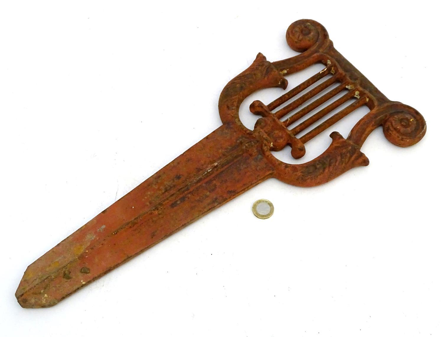 A Victorian cast iron bootscraper, formed as a lyre above a long blade mount, 19" long Please Note - - Image 2 of 3