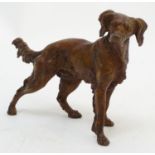 A cold painted bronze model of a gun dog. Approx. 7" high x 10 1/4" long Please Note - we do not