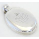 A large Victorian silver hip flask of ovoid form. Engraved ' presented to Henry J Lamson by the
