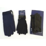 Two pairs of children's black riding gloves, to include one leather pair and one cotton pair.