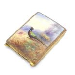 A gilt metal match book case / vesta case with enamel decoration to lid depicting a pheasant in a