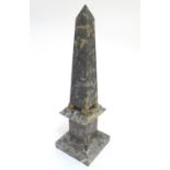 A grey-white marble miniature obelisk, with ball feet, standing on a stepped plinth, 16" tall Please