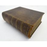 Book: A large 19thC illustrated Family Bible, the binding having tooled decoration. Published by
