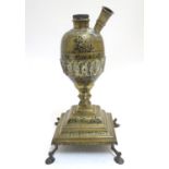 A brass Eastern hookah pipe base, with incised decoration, 15" tall Please Note - we do not make