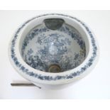A Victorian water closet bowl / pan with blue and white transfer decoration depicting floral