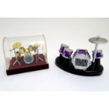 Toys: Two sets of finger drums, one drum kit within a domed case, the other a novelty desktop