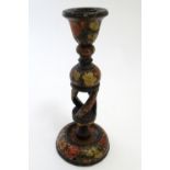 A 20thC Kashmiri candlestick with open twist column and hand painted floral decoration. Approx. 9"