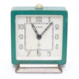 An Art Deco alarm clock by LeCoultre, Switzerland, of squared form, the dial signed LeCoultre,