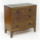 A mahogany Regency chest of drawers with a rectangular top above two short over two long drawers