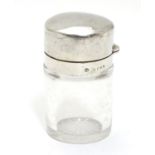 A Victorian glass scent/salts bottle with stopper and silver hinged lid. Hallmarked London 1886