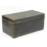 A Regency leather bound camphor wood trunk with brass stud detailing and flanked by carrying