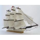 An early 20thC scratch built naive model of three mast ship / boat with flags to include Bavaria and