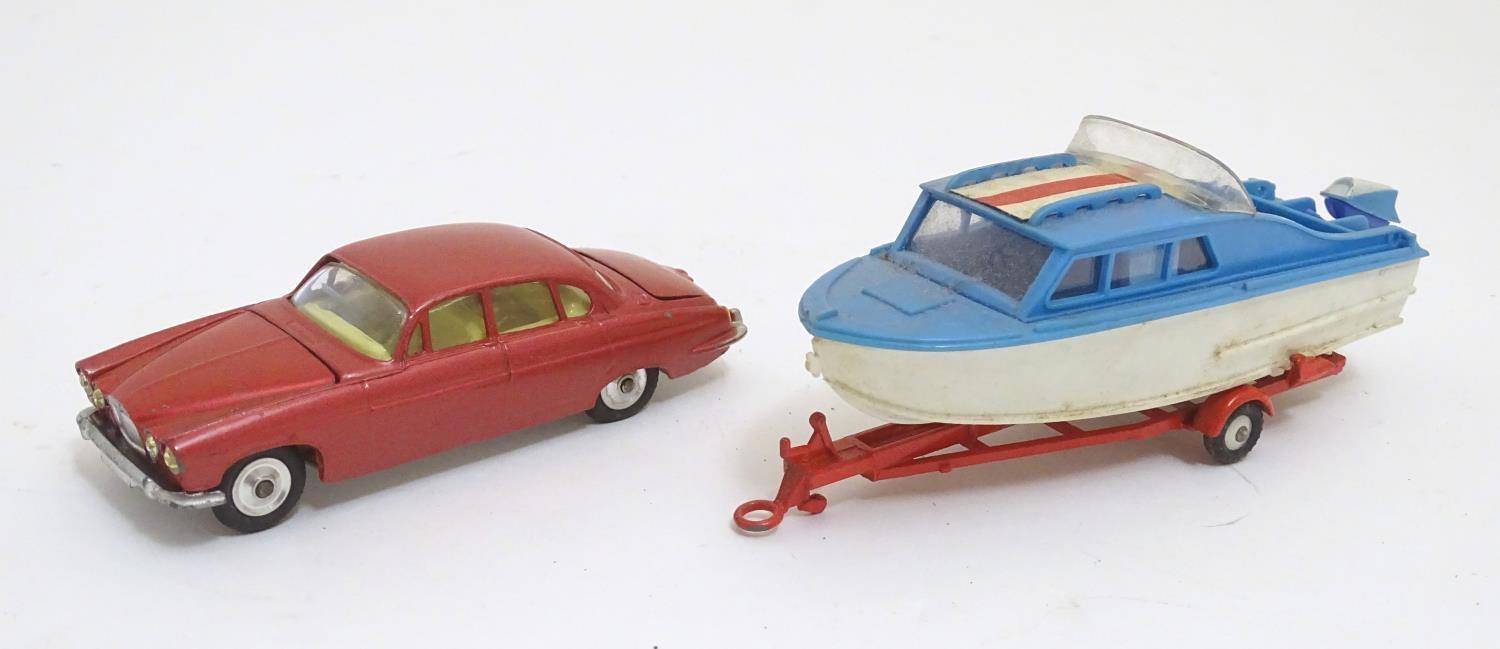 Toys: Two die cast scale model boat and car Corgi Toys to include a Dolphin 20 Cruiser on Wincheon - Image 4 of 8