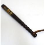 An early 20thC Manchester Police Special Constable's truncheon with leather strap by J. Tyzack &