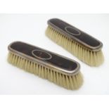 A pair of silver and tortoiseshell mounted clothes brushes. Hallmarked Birmingham 1922 maker