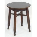 Vintage Retro, Mid-Century: a circular occasional table, the base consisting of four carved beech