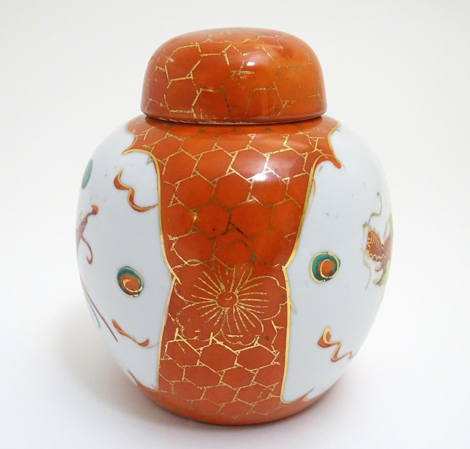 An Oriental ginger jar with hand painted decoration with lobed panels depicting a stylised dragon - Image 3 of 8
