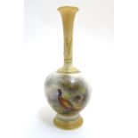 A Royal Worcester bottle shaped vase with hand painted decoration by James Stinton with pheasants in