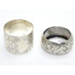 Two silver napkin rings with engraved decoration. Hallmarked Birmingham 1906 maker William M Hayes