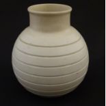 A Wedgwood globular 'bomb' vase designed by Keith Murray with a collar neck and ribbed body, shape