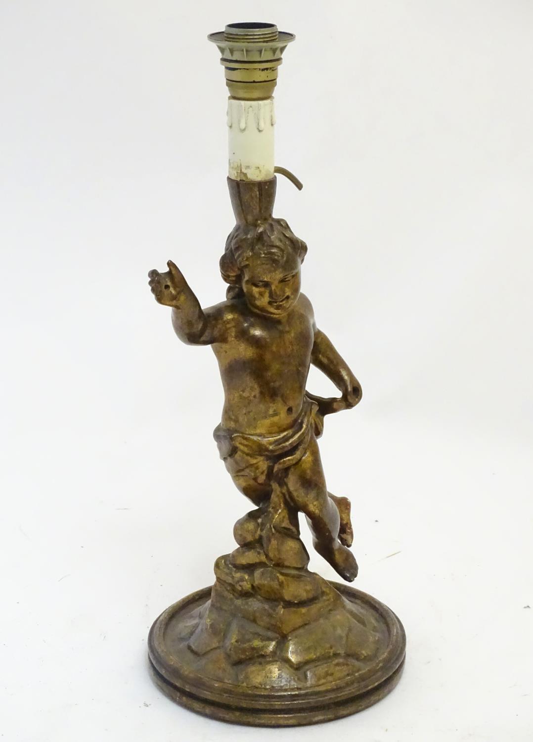 A 20thC Italian carved wooden lamp, formed as a putto with gilt finish and circular base, 21 1/4" - Image 3 of 5