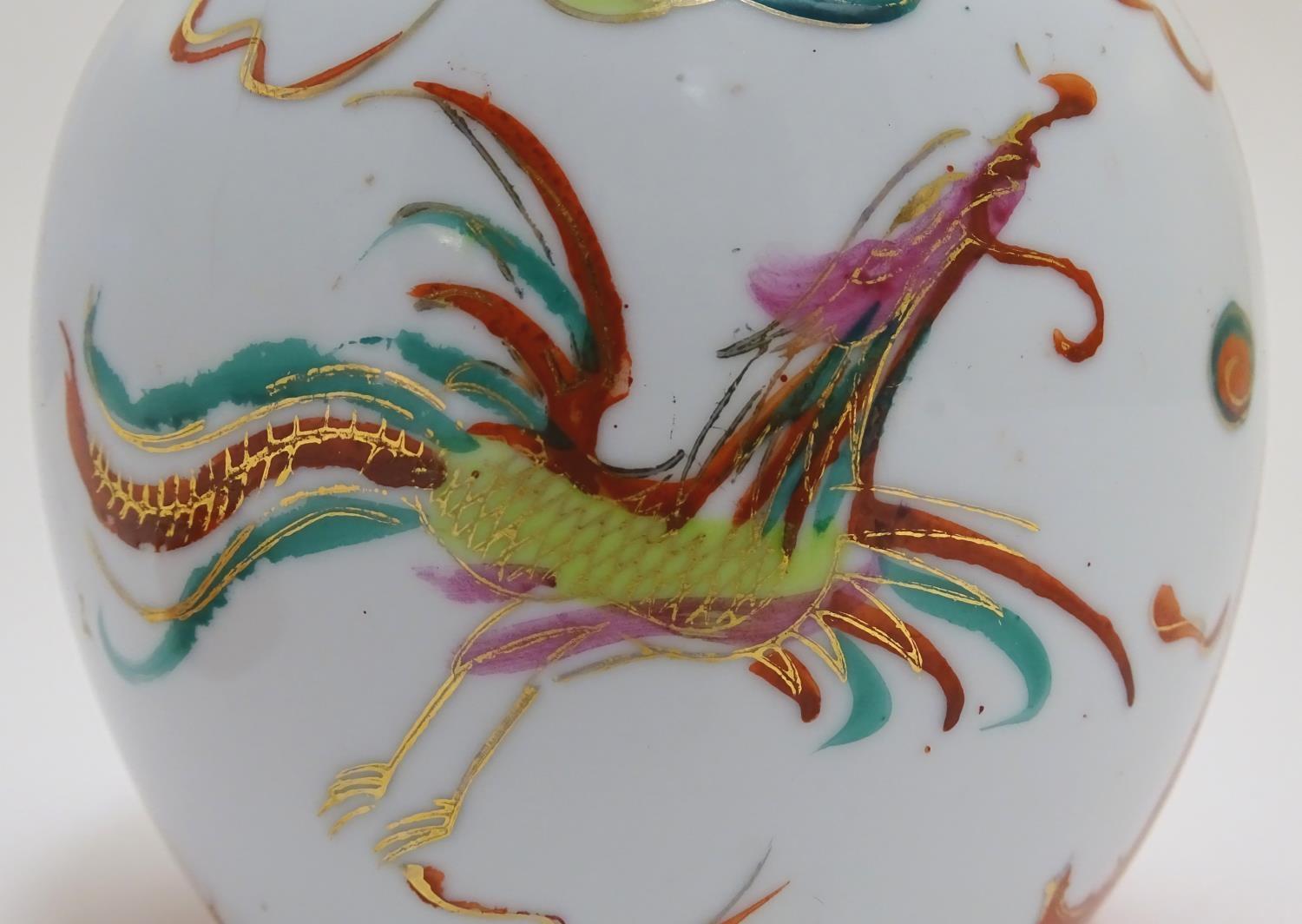 An Oriental ginger jar with hand painted decoration with lobed panels depicting a stylised dragon - Image 6 of 8