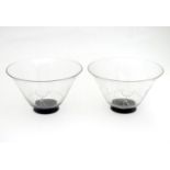 A pair of Art Deco glass dessert bowls in the manner of Orrefors, of tapering form with black