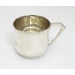 A Silver christening cup, the front engraved with three graduated teddy bears. Hallmarked Birmingham
