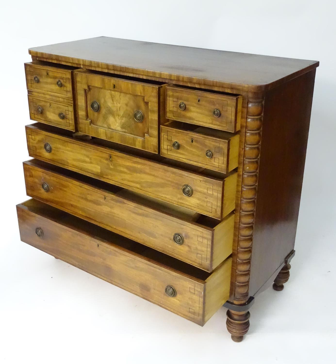 A late 19thC mahogany north country chest of drawers comprising a central geometrically moulded - Image 6 of 9