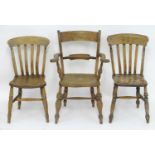 Three 19thC Windsor chairs. An Oxford bar back with swept arms and an elm seat, raised on turned