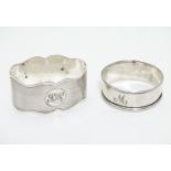 A silver napkin ring with engine turned decoration, hallmarked Chester 1925 maker S Blanckensee &