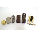 An assortment of late 20thC cigarette lighters, to include an example by Dupont (6) Please Note - we