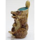 A Joseph Holdcroft majolica jug modelled as a seated bear, the handle formed as a soon. Approx. 6