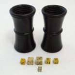 Toys: A pair of treen 19thC waisted ebonised wooden dice shakers with horizontal ribbed interiors