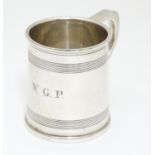 A silver Christening mug with banded detail. Hallmarked Birmingham 1929 maker A & J Zimmerman Ltd. 2