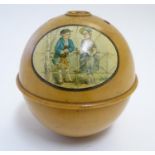 A 19thC turned wooden string box of spherical form in the Mauchline ware style with applied
