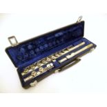 Musical Instrument : a cased Boosey & Hawkes 'Emperor E' flute, serial number 575360. 26" long