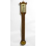 A mid 20thC stick barometer, the plate marked ' Comitti, Holborn', mahogany case with brass finials.