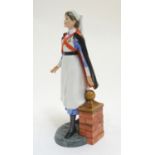 A Royal Doulton Classics Figure model of a nurse, no. HN4287, modelled by Adrian Hughes. Approx. 8