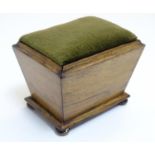 A 19thC rosewood pin cushion of sarcophagus form with four bun feet. Approx. 4 1/4" high Please Note