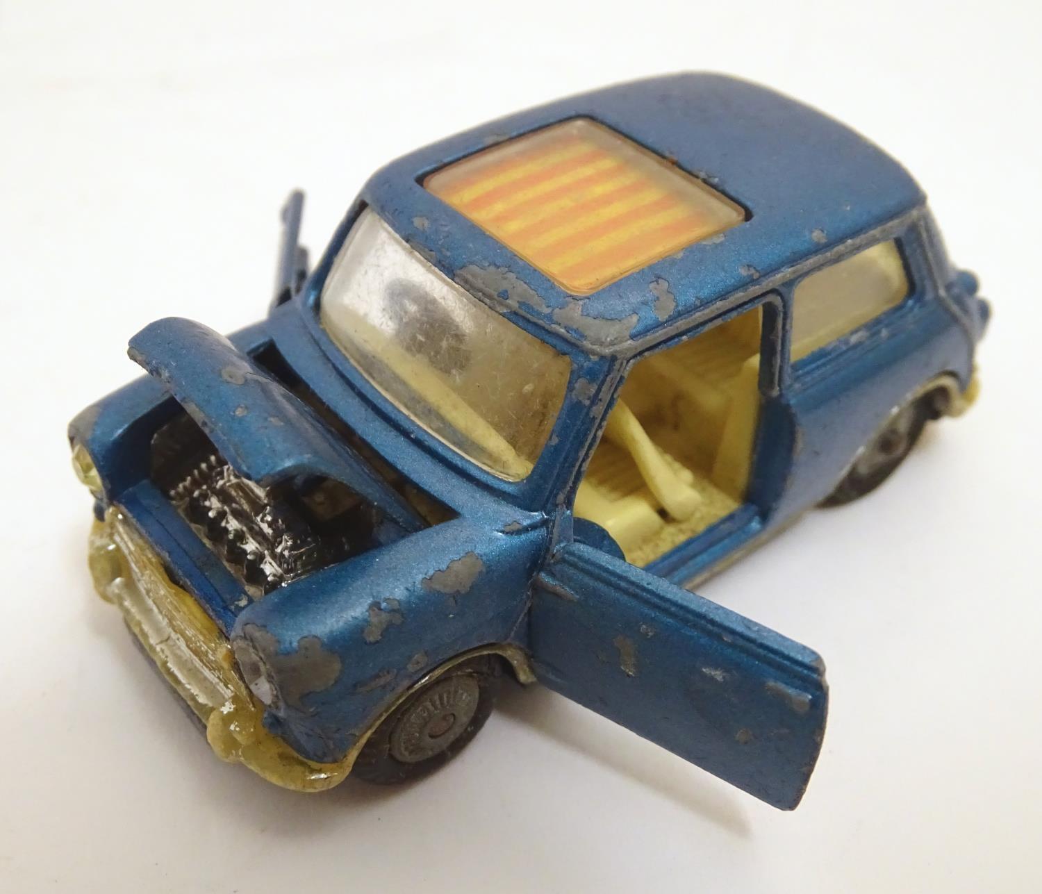 Toys: Four Corgi Toys die cast scale model cars comprising BMC Mini Cooper S with a blue body and - Image 5 of 9