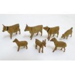 A quantity of early 20thC hand carved miniature wooden animals to include cows, sheep, deer etc.